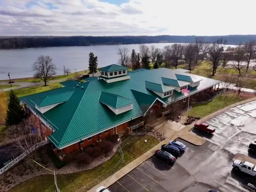 Tarping and dry-in on a Viking Meadows commercial roof